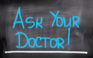 ask your doctor message written on chalk board