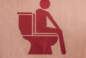 image of human on toilet