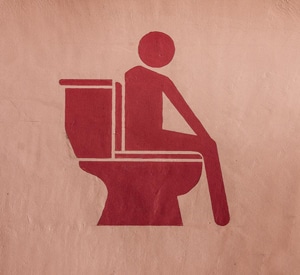image of human on toilet