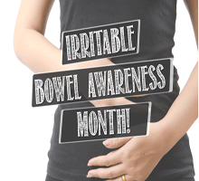 IBS awareness month image with text over woman holding her stomach